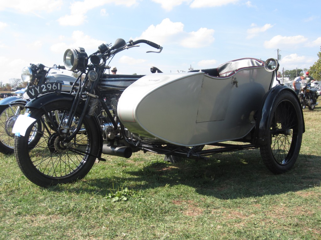1923 Norton Big 4 with a magnificent side hack and a picnic basket behind  the chair. Absolutely gorgeous!!